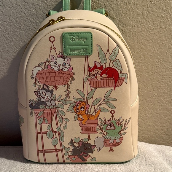 Loungefly Handbags - Loungefly Cream and Mint Pet-Themed Backpack by Disney Loungefly. 10Lx8Dx5W